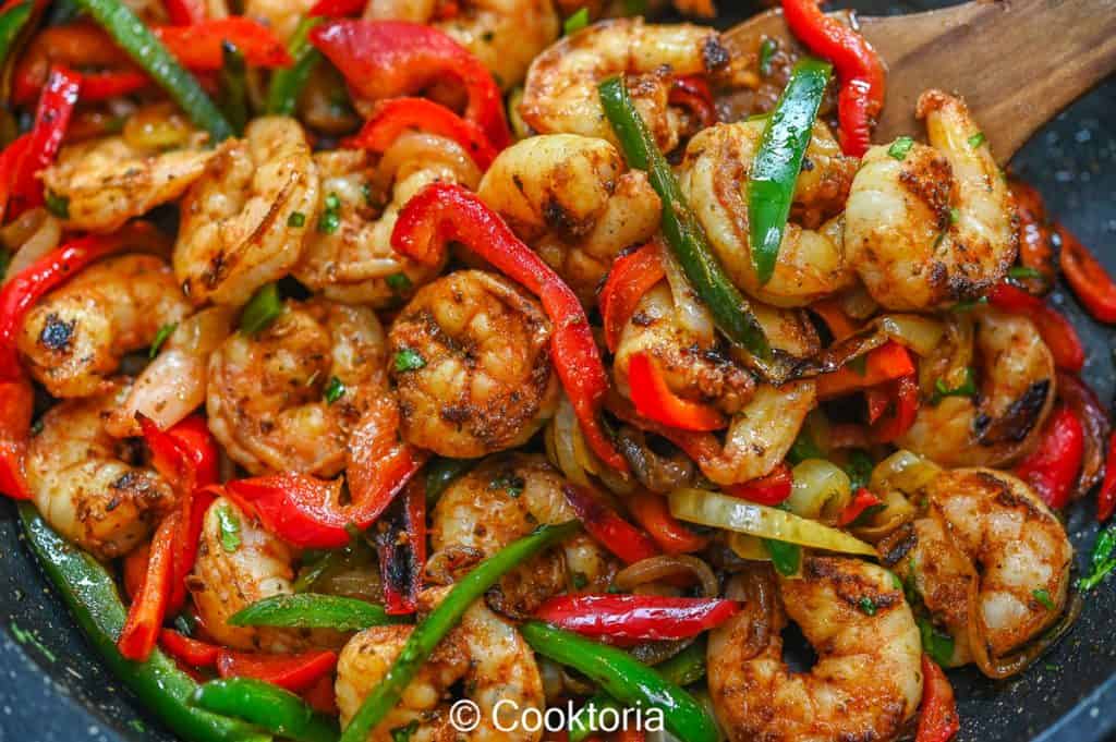 Shrimp Fajitas on a wooden spatula